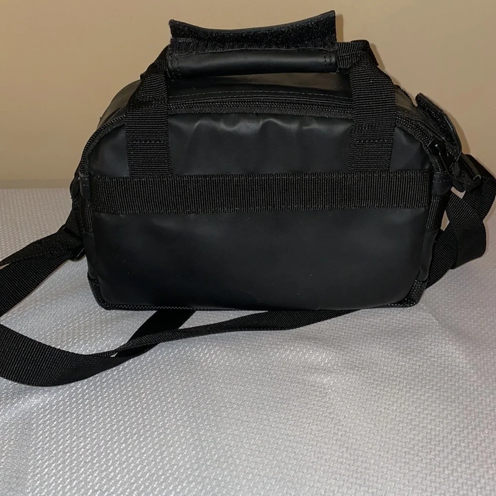 Canon camera bag black carrying case travel padded zipper pockets strap handle